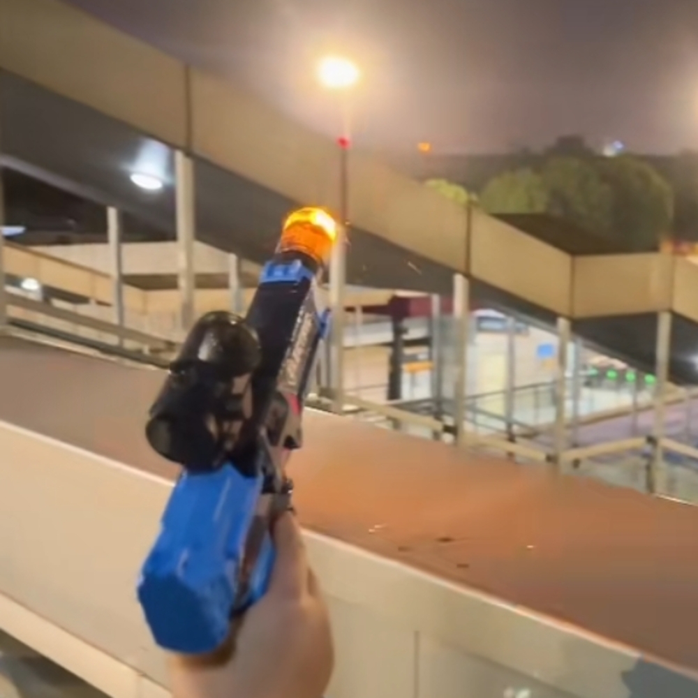 Blue and Black Toy Gun with Orange Tip
